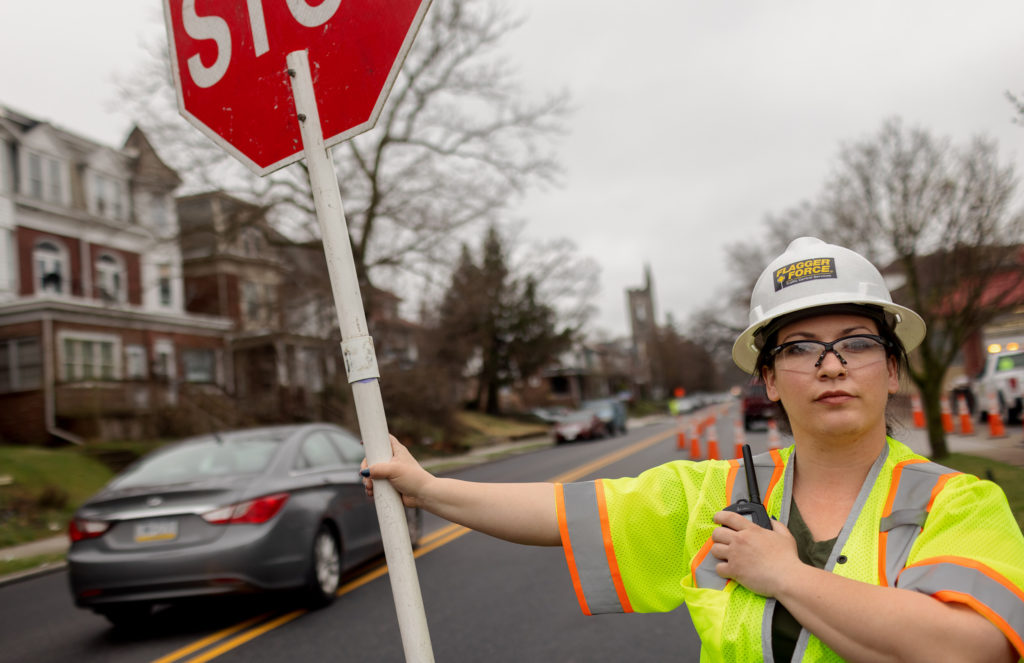 Jackie McVey actively flagging a work zone