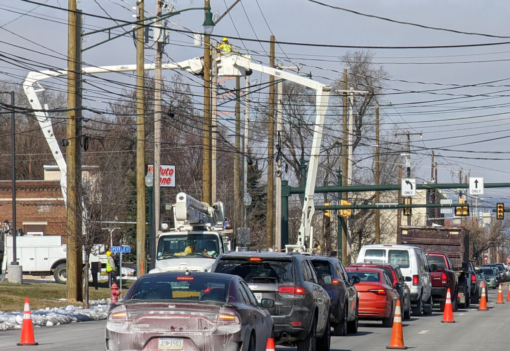 bucket truck, working on power lines in Flagger Force work zone