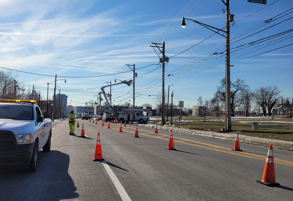 bucket truck, working on power lines in Flagger Force work zone