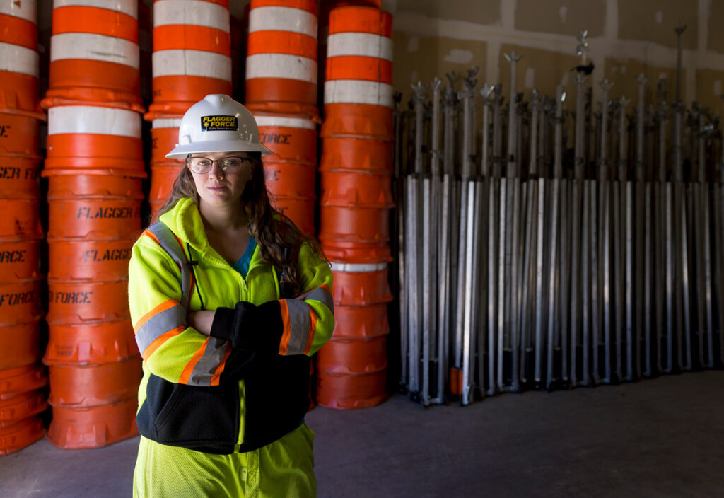 Employee Spotlight: Kristin posing in uniform in warehouse