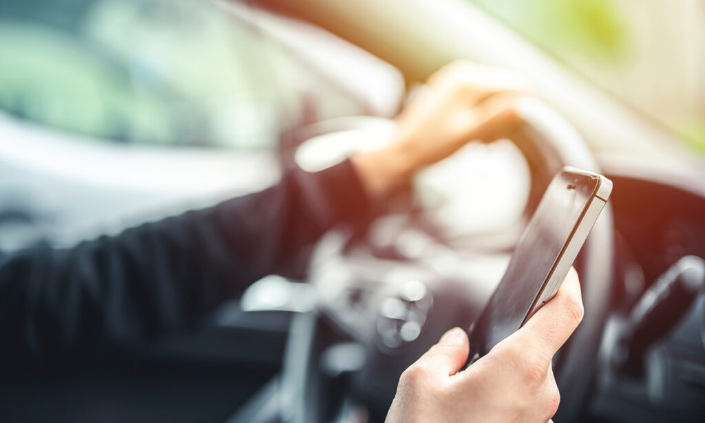 Distracted driver using cellphone while behind the wheel