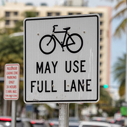 road sign: bikes may use full lane