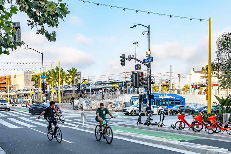 traffic safety—kids riding bikes in road, motorized bikes ready to rent on sidewalk