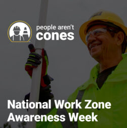 Flagger Force crew member holding a paddle. Includes the text overlay "National Work Zone Awareness Week".